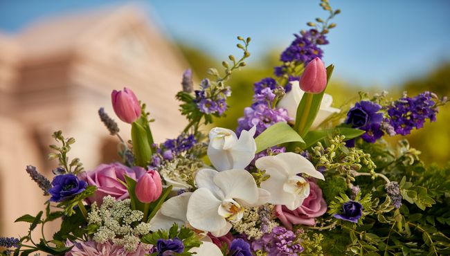 Close up view of the colorful flowers on the edge of a memorial wreath
 at Pacific View