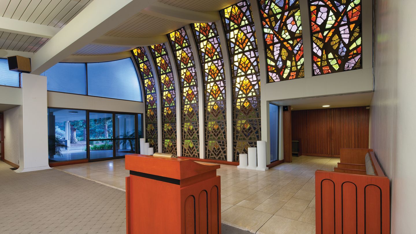 Inspiring hope and serenity, Memorial Chapel at Rose Hills Memorial Park & Mortuary features a wall of floor-to-ceiling stained glass. 