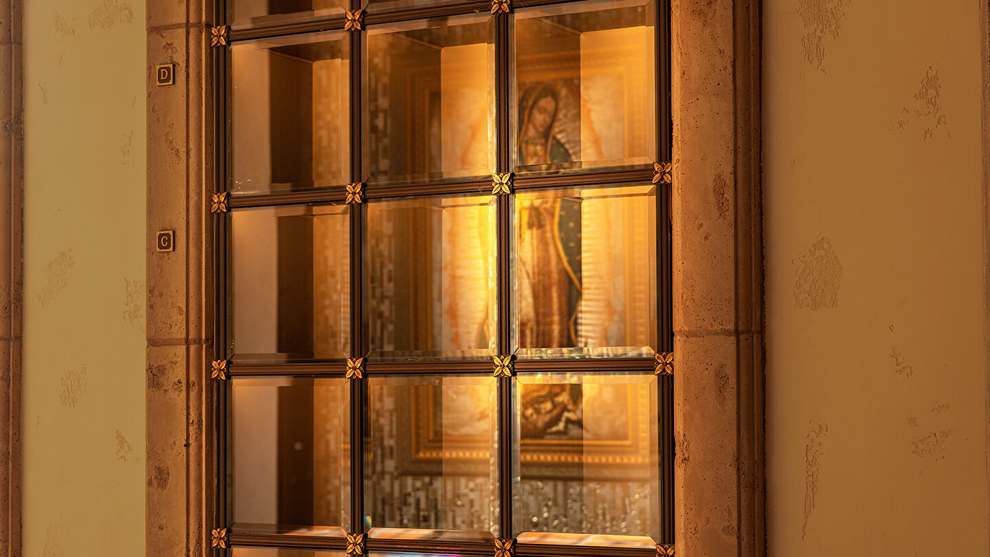 Interior glass-front niches facing the blessed image of Our Lady of Guadalupe 